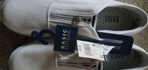 Cute white, casual, slip-on canvas shoes. New with tags. Smoke/pet free.
